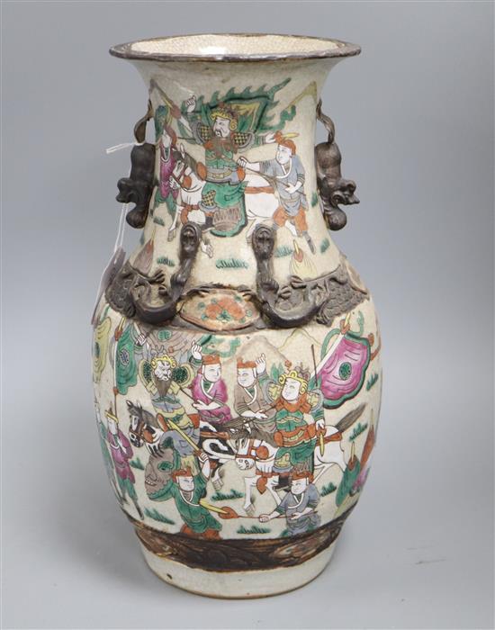 A Cantonese two handled vase, painted with warriors H.35cm